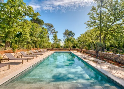 The long pool and sunloungers of Hameau Font, an estate in Green Provence.